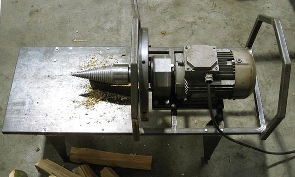 A cone log splitter is used for splitting large chocks