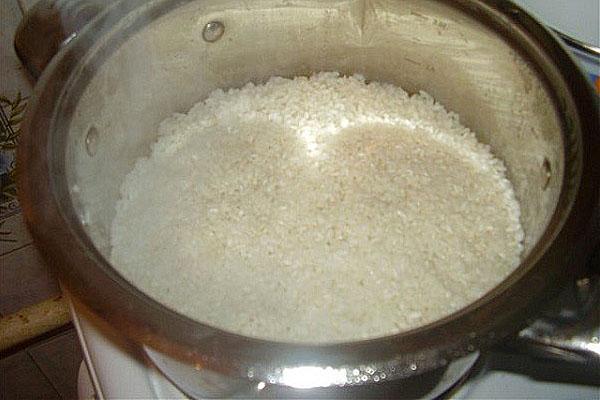 cook rice until half cooked