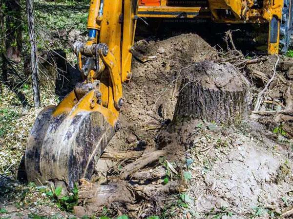 mechanized method of uprooting stumps